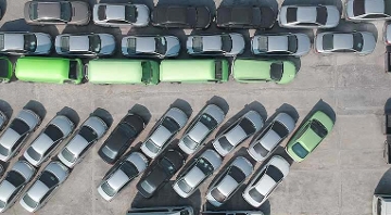 green and black parked cars