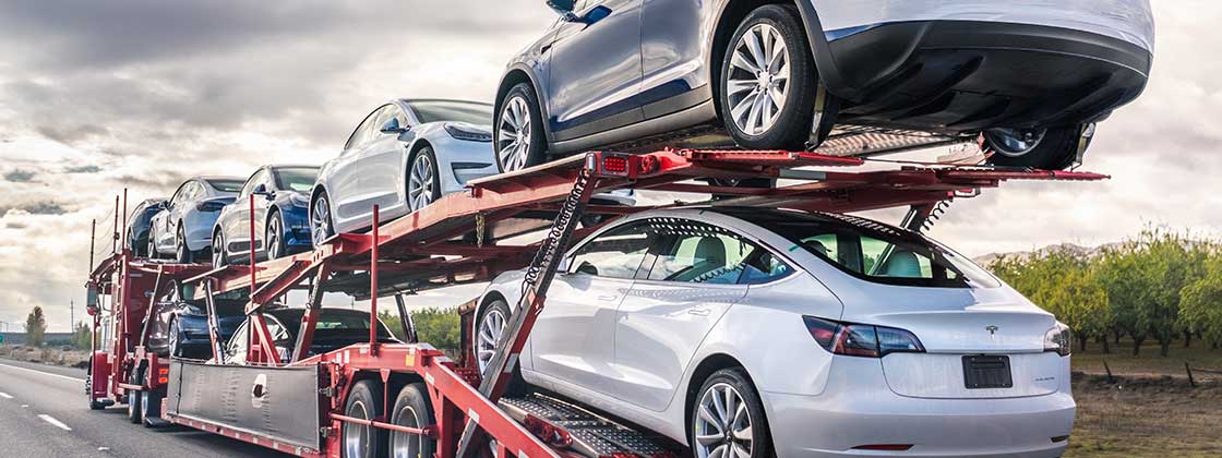 Tesla's on a car hauler truck