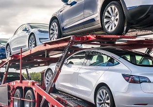 Tesla's on a car hauler truck