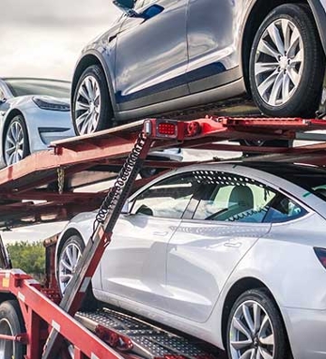 Tesla's on a car hauler truck