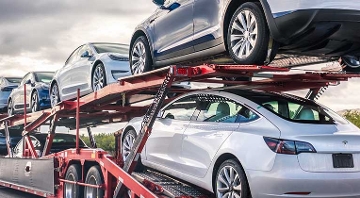Tesla's on a car hauler truck