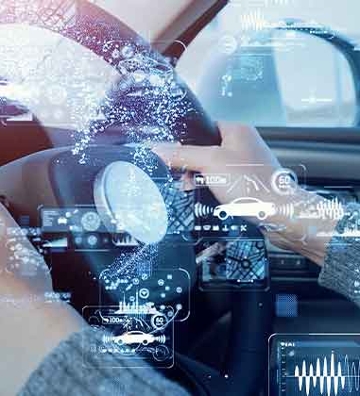 digital images over hands on a steering wheel