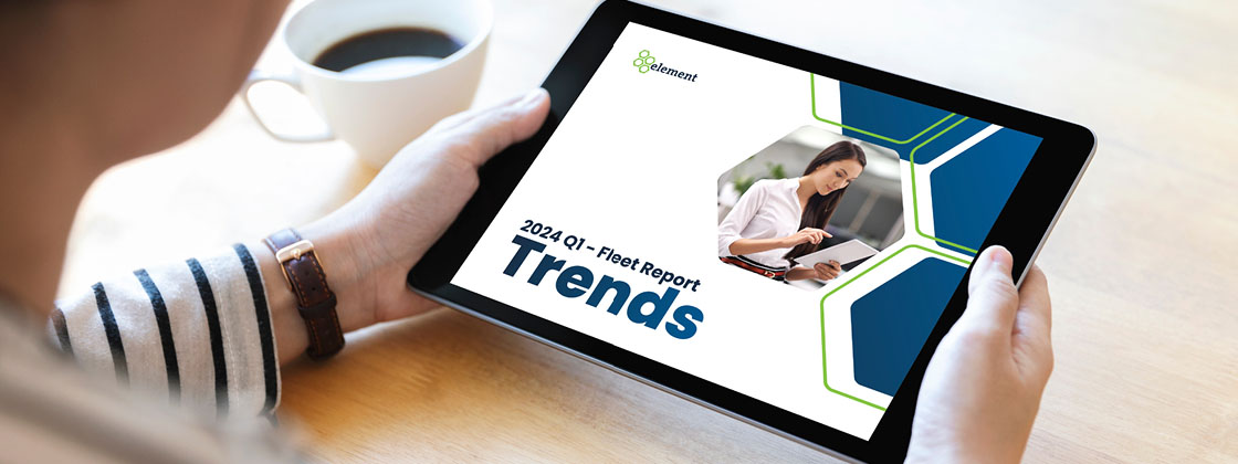 woman holding tablet showing trends report