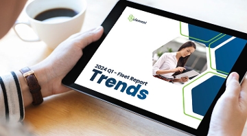 woman holding tablet showing trends report