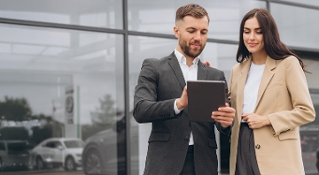 Two people reviewing the 2024 Q4 fleet trends report